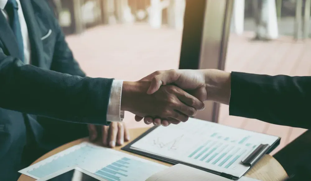 Business advisors review financial reports and management reporting needed for investor readiness.