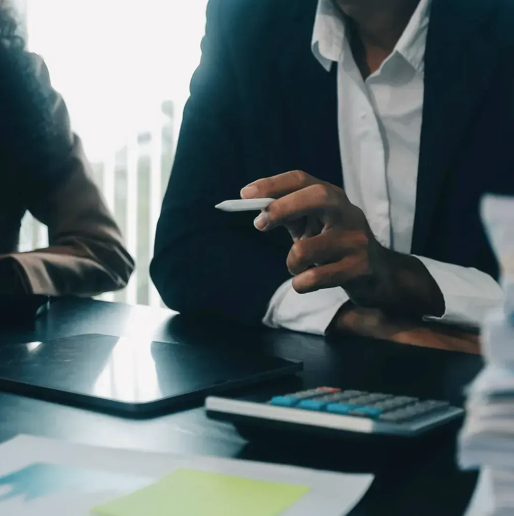 A finance team reviews month-end bookkeeping records and financial reports.